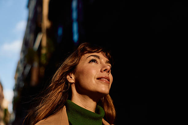 istock Woman looking up smiling with hope for future 2247353634