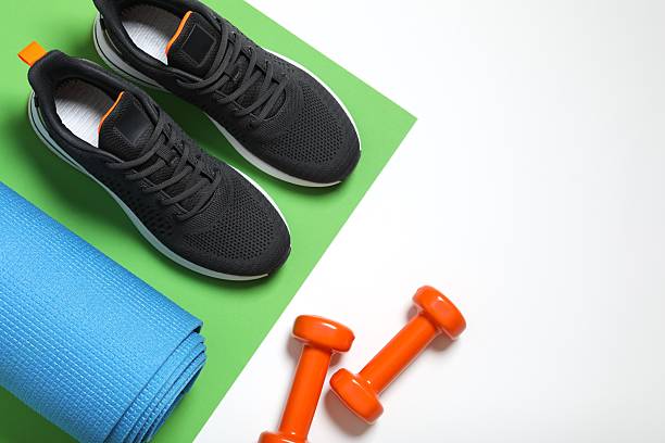 istock Sport lifestyle accessories on color paper table 2247353711