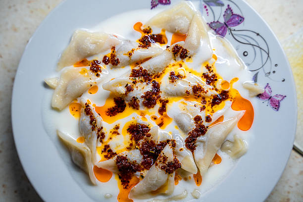 istock homemade manti with yogurt and sauce 2247354305