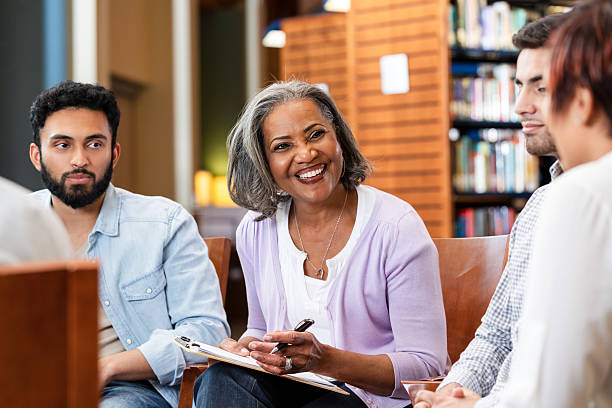 istock Diverse group in discussion at indoor meeting, smiles and engagement apparent 2247357343