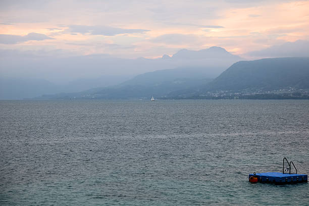 The fog lifted, hazeing the landscape and altering the appearance of the surroundings visible from Seewalchen am Attersee in Austria on a calm day.