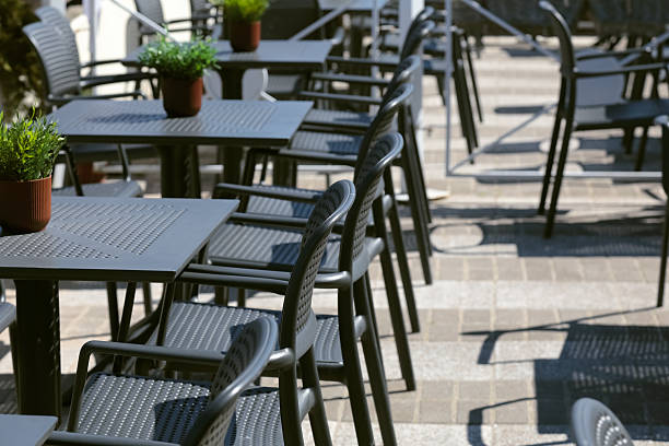 istock The seats at the outdoor cafe are still empty 2247358905