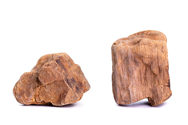 istock Natural rocks, black rough mountain rocks, red hard rocks for construction work on white background. 2247361925