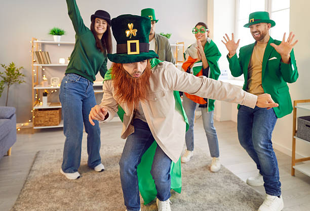 istock Happy friends having party and dancing celebrating Saint Patrick's Day. 2247363756