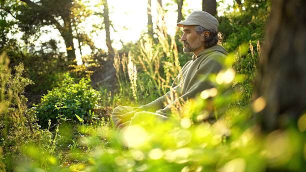istock Forest Meditation. Mature Man Relaxes Connecting With Nature 2247369199