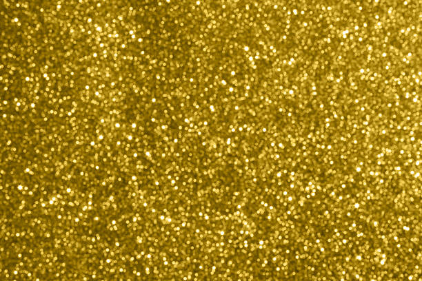 Abstract gold glitter sparkle texture with bokeh background