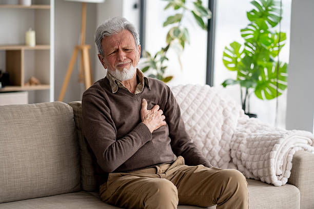 istock Elderly man in emotional pain on his couch 2247371009