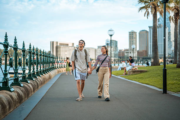 istock Young Hispanic Couple Exploring Sydney Harbor Walkway 2247371156