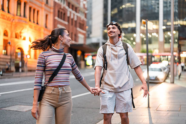 istock Cheerful Hispanic Couple Exploring Vibrant Sydney Streets at Sunset 2247371193