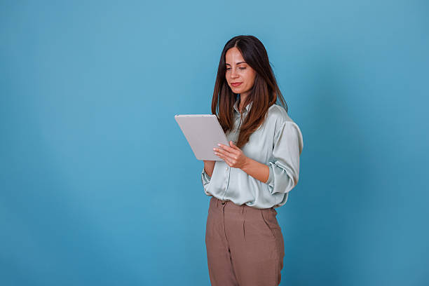 istock Professional woman using digital tablet, browsing business data and interacting with online technology 2247372926
