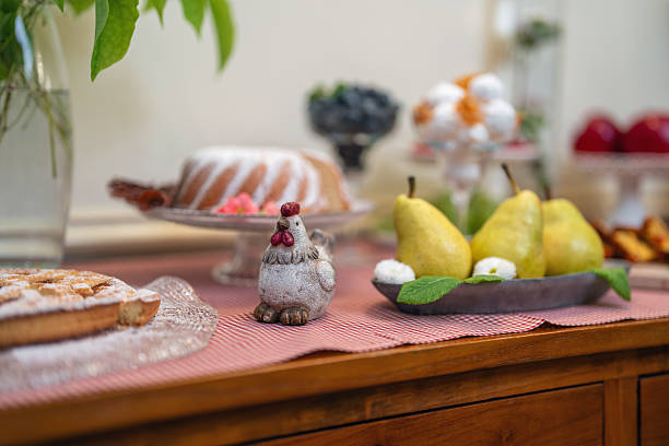 A close-up reveals a variety of morning delicacies at a boutique hotel's breakfast bar, including fresh fruit and baked goods, arranged with charming vintage decor.