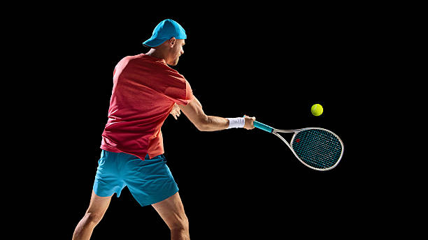 istock Tennis player hitting powerful backhand shot during fast game moment 2247375978