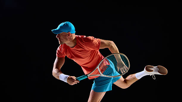 istock Concentrated tennis player preparing for return with intensity and power 2247375983