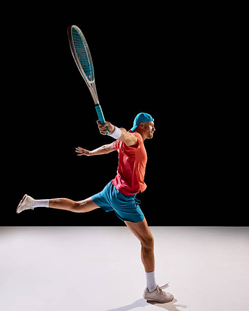 istock Tennis player stretching body for extended forehand reach in full motion 2247375984