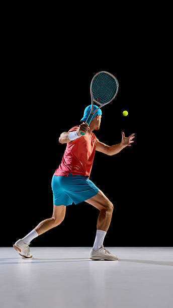 istock Focused tennis player preparing to strike ball with strong concentration 2247375987