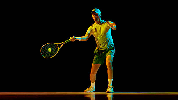 istock Confident tennis player preparing for serve with determination and bright light 2247376023