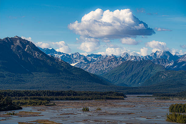 istock Alaska's braided river valley under snow-capped peaks. 2247376159