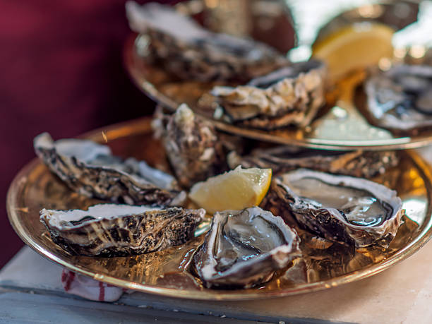 istock Dine on Freshly Shucked Oysters with Lemon Garnish 2247377079