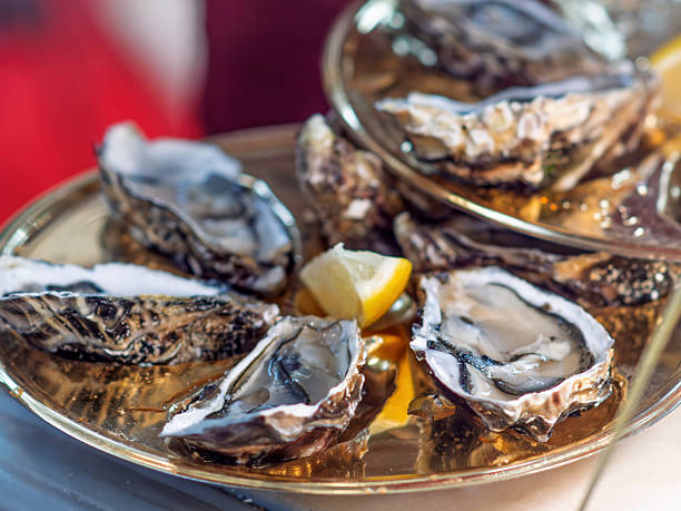 istock Freshly Shucked Oysters on a Decorative Platter 2247377084