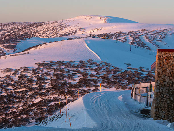 istock Late afternoon light on ski resort mountains 2247380411