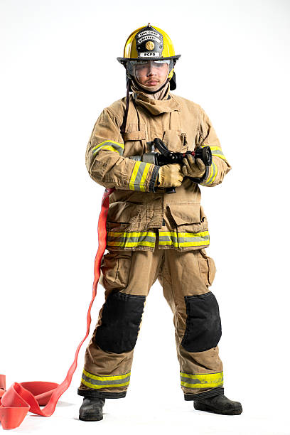 istock Portrait of a firefighter in protective uniform holding a firefighting and fire hose nozzle 2247380480