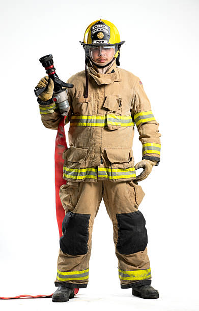 istock Portrait of a firefighter in protective uniform holding a firefighting and fire hose nozzle 2247380498