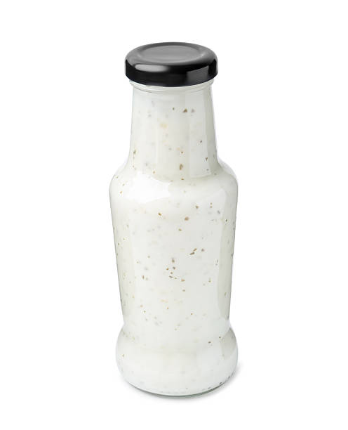 istock Delicious sauce in glass bottle isolated on white 2247380818