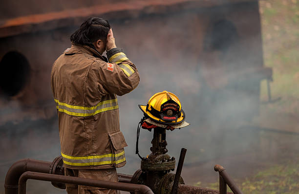 A feeling regret of a firefighter, rest and relex after performing an emergency response at fire hydrant valve