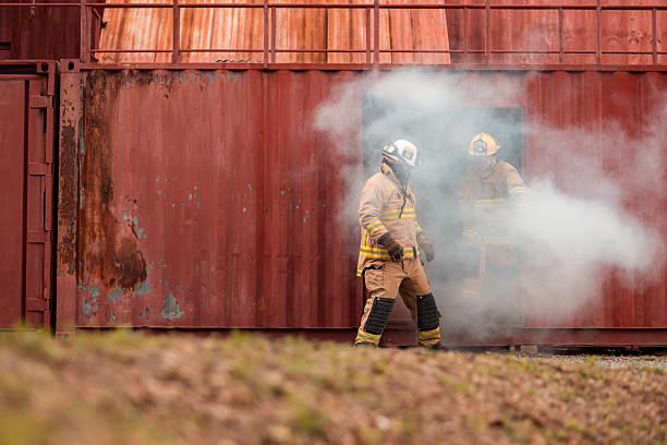 istock Firefighters in full protective gear participate in a training exercise outside 2247381072