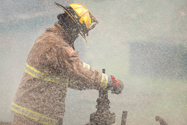 istock A firefighter in protective gear manually turns off a water valve 2247381159