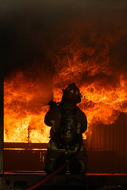 istock A firefighters in full protective gear work to extinguish a massive blaze 2247381602