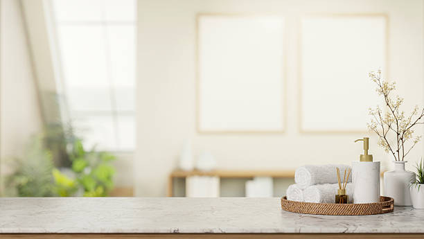 istock White body wash lotion pump bottle and towel and diffuser on marble stone counter in bright spa room 2247384829