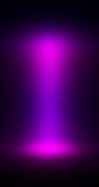 istock A bright, focused magenta and purple spotlight illuminates an empty, textured background, creating a dramatic and rich studio effect. 2247385883