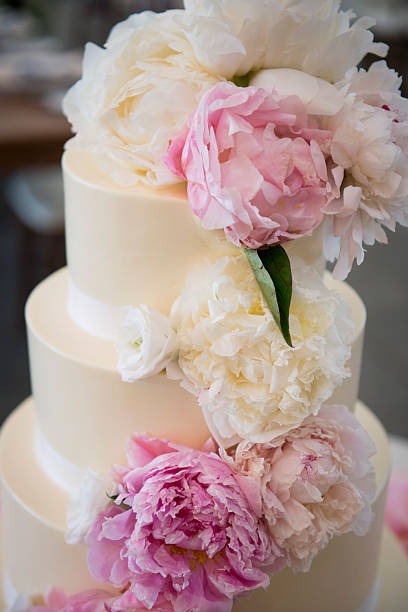 istock Elegant Wedding Cake with Peonies and Soft Floral Accents 2247387122