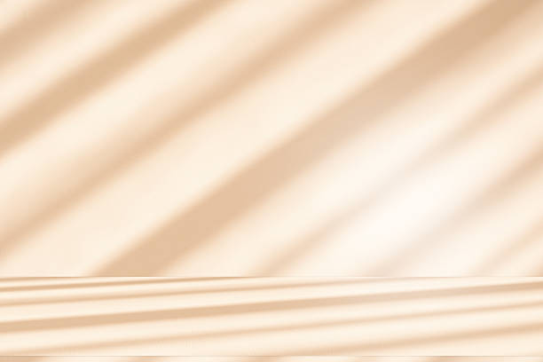istock Studio style background wall decoration presentation uses white and beige tones. with shadows cast from a nearby window, concept creating a decorative 2247389088