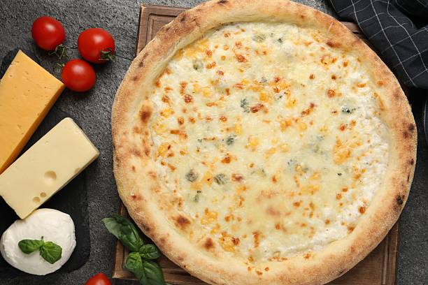 istock Delicious cheese pizza and ingredients on dark grey table, flat lay 2247390854