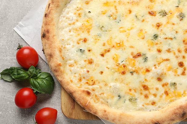 istock Delicious cheese pizza, basil and tomatoes on light grey table, flat lay 2247390869