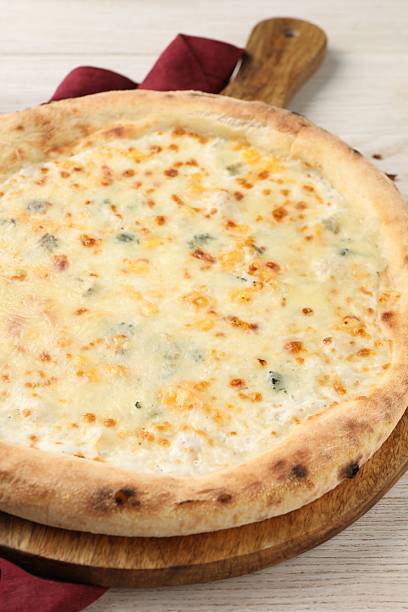 istock Delicious cheese pizza on white wooden table, closeup 2247390976