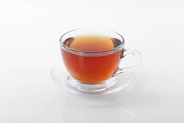 istock Tasty tea in cup on white background 2247391689