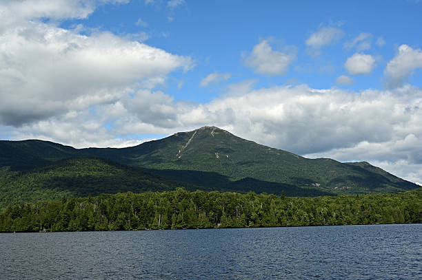 istock Bright summer cloudscape over Lake Placid, New York State on sunny afternoon. 2247391788
