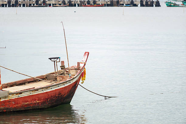 istock Traditional Fishing Boat on Serene Water 2247395068