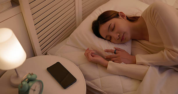 istock asian female wear smart ring sleeping home 2247395362