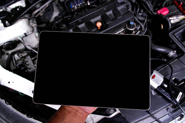istock Tablet diagnostic device for car engine check, close-up of mechanic hand holding digital tablet with blank screen 2247395647