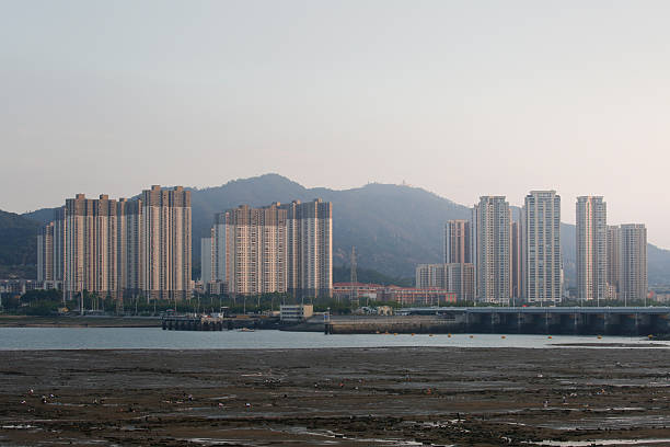 istock Panoramic View of Coastal Residential Area with Distant Mountains in the Background 2247396836