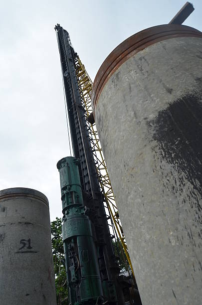 Hydraulic Pile Driver Operating with Concrete Piles at Civil Engineering Site