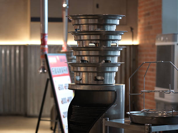 istock Kitchen Equipment Display: Stainless Steel Steamer Baskets Stacked on a Commercial Cooking Appliance 2247398726