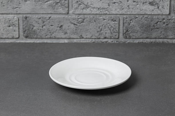 istock Simple white plate on textured background highlighting minimalist design and subtle details 2247403221