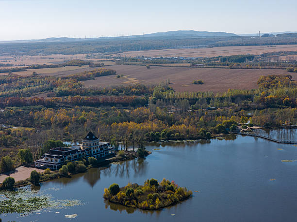 istock Autumn Landscape with Lakeside Villa and Rural Fields from Aerial View 2247403862