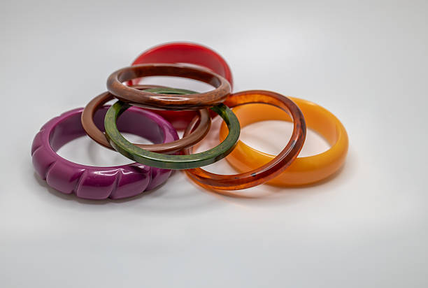 istock Colorful vintage bakelite bracelets on white background 2247405991