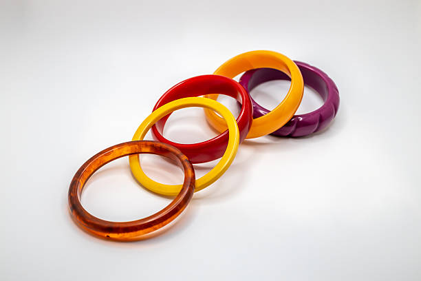 istock Colorful vintage bakelite bracelets on white background 2247405998